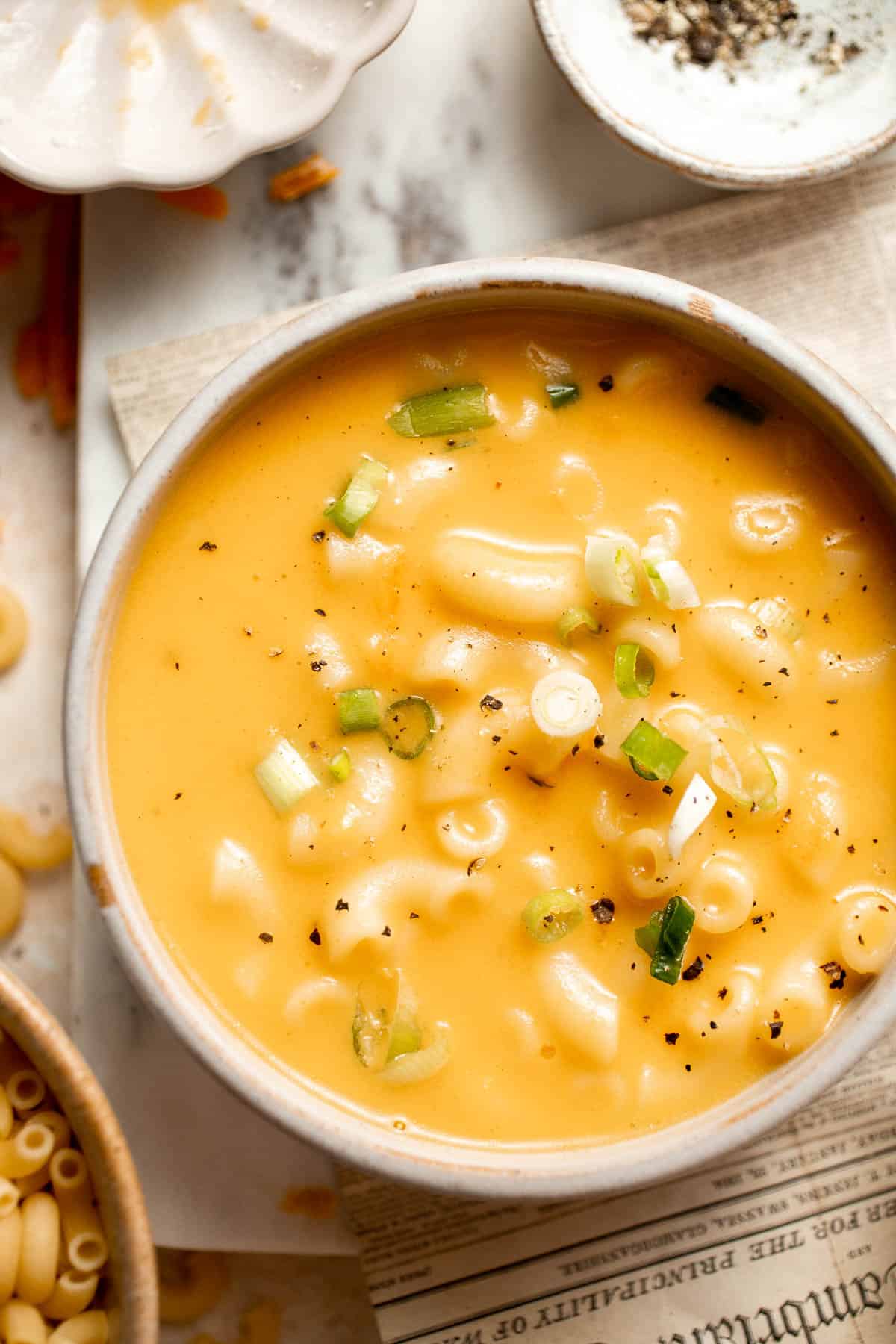 This decadent Mac and Cheese Soup is everything you love about macaroni and cheese turned into a rich and creamy soup. Ready in just 30 minutes! | aheadofthyme.com