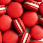 These homemade Red Velvet Macarons with cream cheese frosting are like the beloved cake but in bite-sized form — bold red color and a hint of cocoa flavor. | aheadofthyme.com
