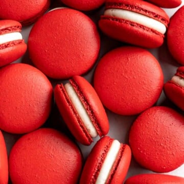 These homemade Red Velvet Macarons with cream cheese frosting are like the beloved cake but in bite-sized form — bold red color and a hint of cocoa flavor. | aheadofthyme.com