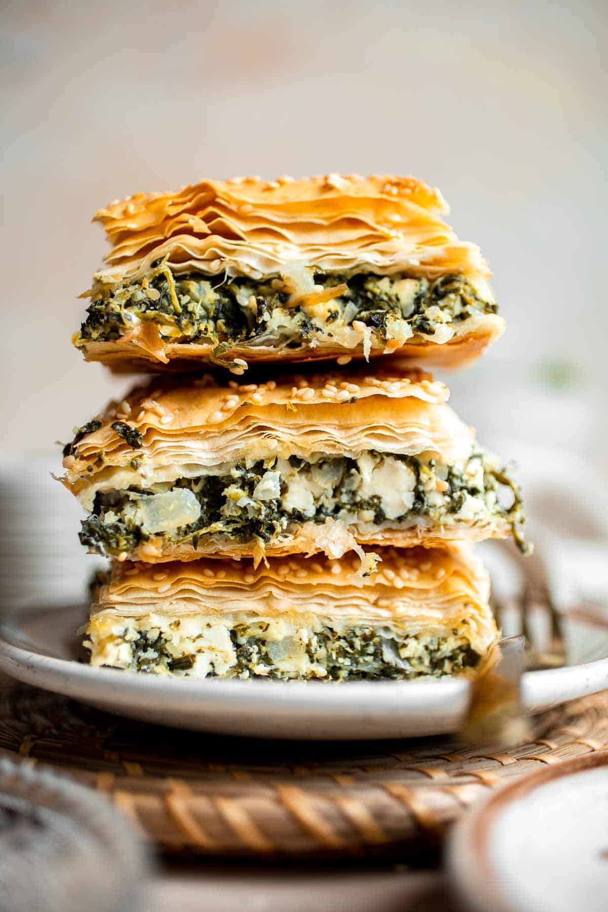 Spanakopita is a traditional Greek savory pie famous worldwide for its cheesy spinach filling nestled between layers of phyllo dough. It's easy to make too! | aheadofthyme.com