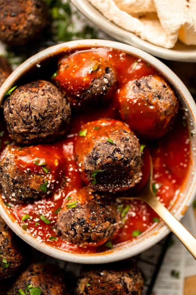 Easy Vegetarian Meatballs are made with cheesy black beans and a mixture of aromatic spices — perfect for adding protein, texture, and flavor to your meal. | aheadofthyme.com