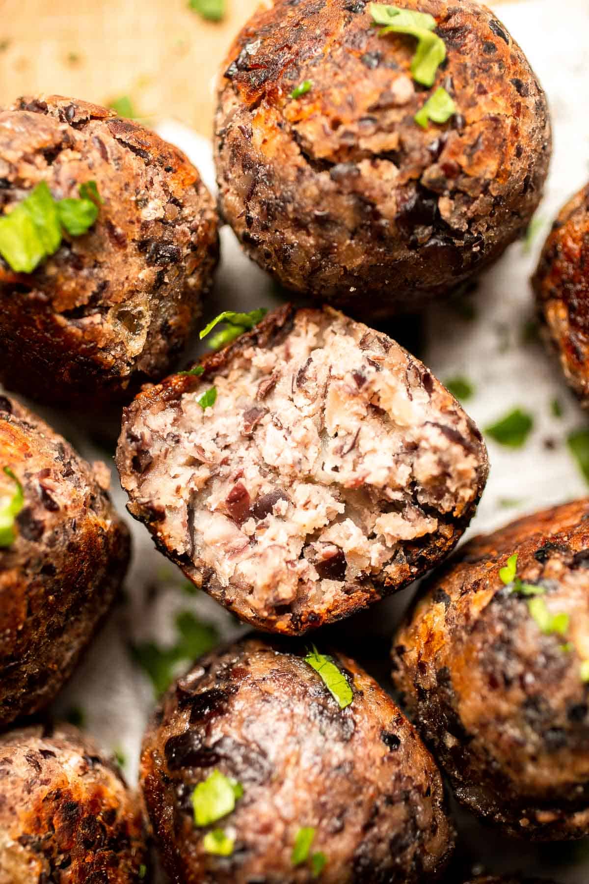 Easy Vegetarian Meatballs are made with cheesy black beans and a mixture of aromatic spices — perfect for adding protein, texture, and flavor to your meal. | aheadofthyme.com