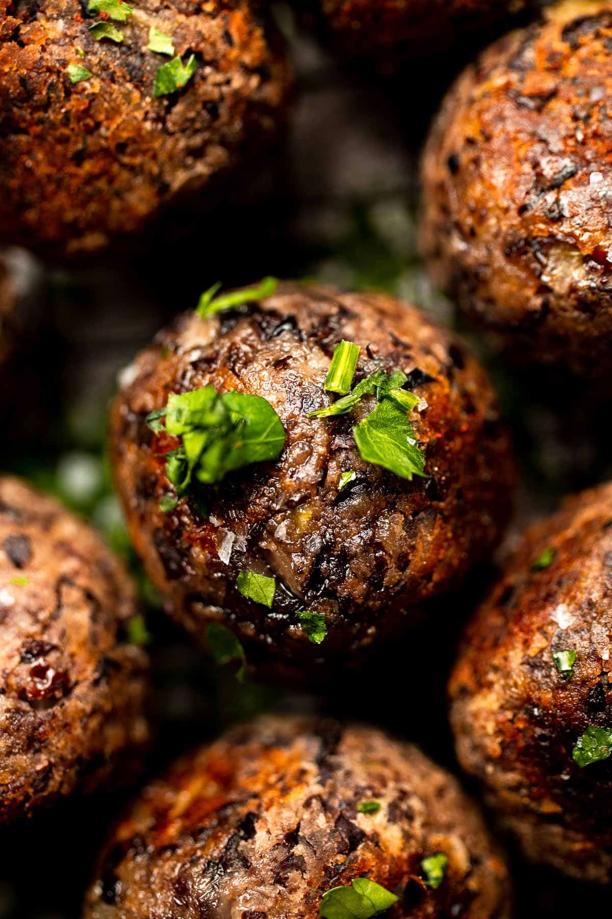 Easy Vegetarian Meatballs are made with cheesy black beans and a mixture of aromatic spices — perfect for adding protein, texture, and flavor to your meal. | aheadofthyme.com