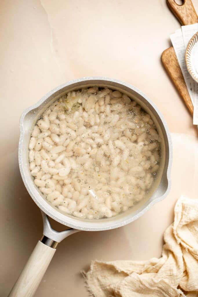 One pot Cannellini Beans are creamy, buttery, and nourishing. Serve them as a simple vegan side dish or as a delicious addition to soups, salads, and more. | aheadofthyme.com