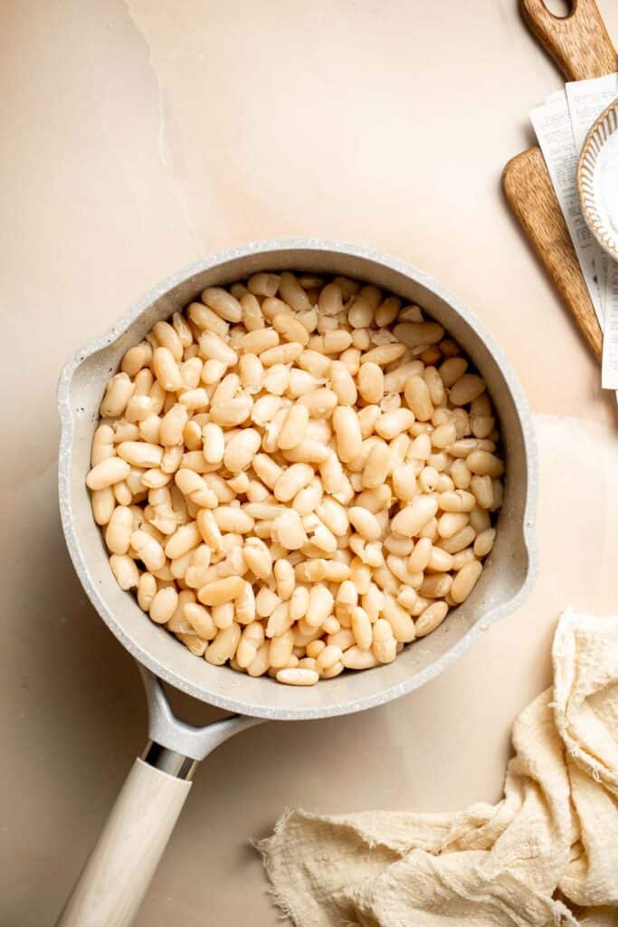 One pot Cannellini Beans are creamy, buttery, and nourishing. Serve them as a simple vegan side dish or as a delicious addition to soups, salads, and more. | aheadofthyme.com