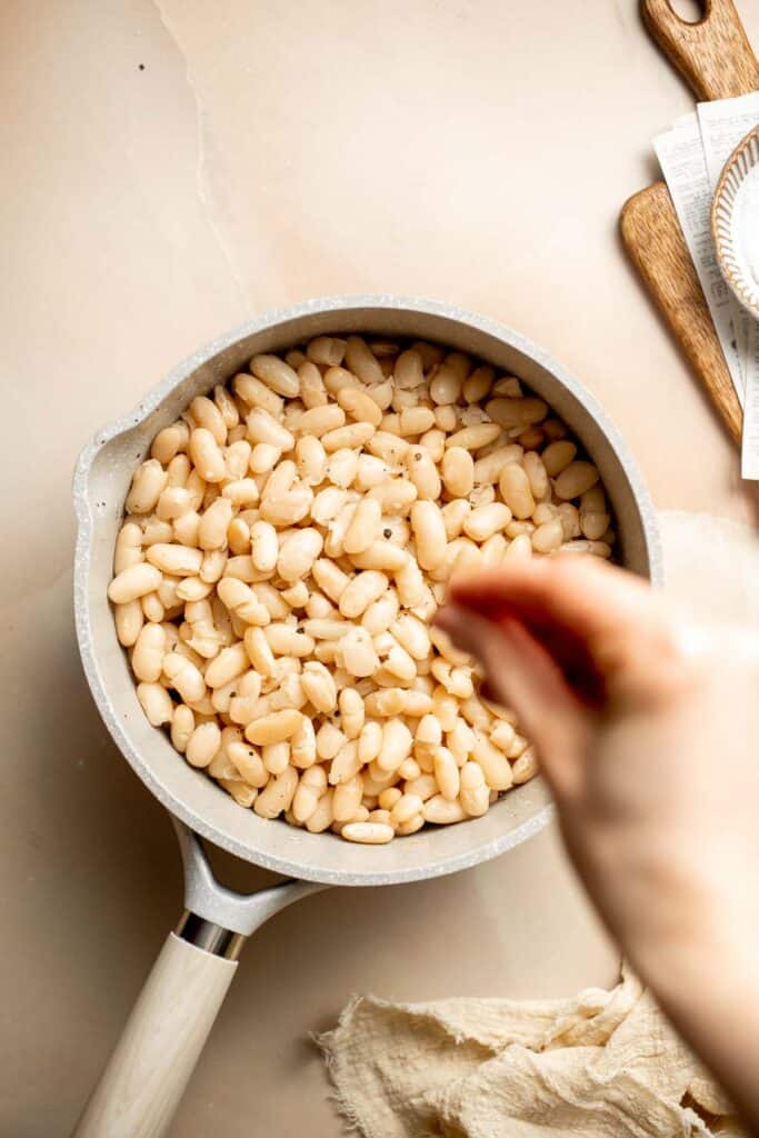 One pot Cannellini Beans are creamy, buttery, and nourishing. Serve them as a simple vegan side dish or as a delicious addition to soups, salads, and more. | aheadofthyme.com