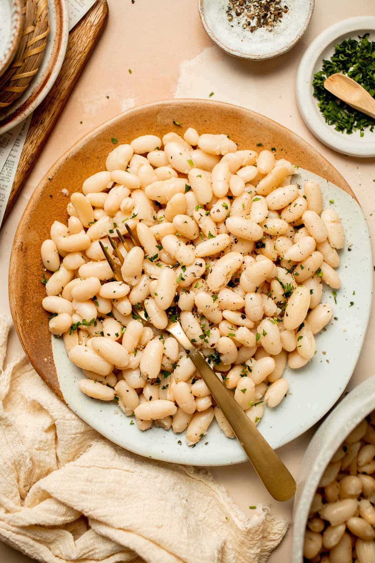 One pot Cannellini Beans are creamy, buttery, and nourishing. Serve them as a simple vegan side dish or as a delicious addition to soups, salads, and more. | aheadofthyme.com