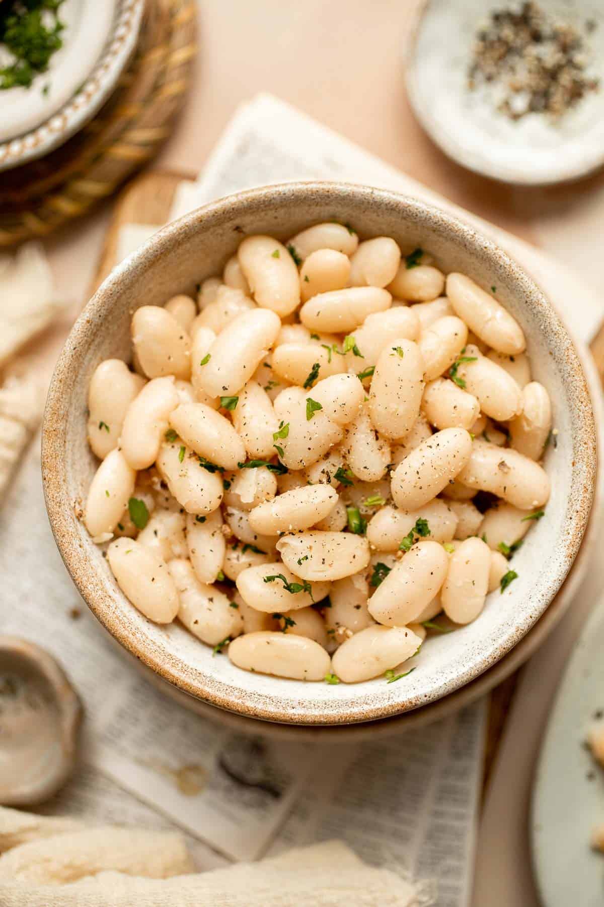 One pot Cannellini Beans are creamy, buttery, and nourishing. Serve them as a simple vegan side dish or as a delicious addition to soups, salads, and more. | aheadofthyme.com