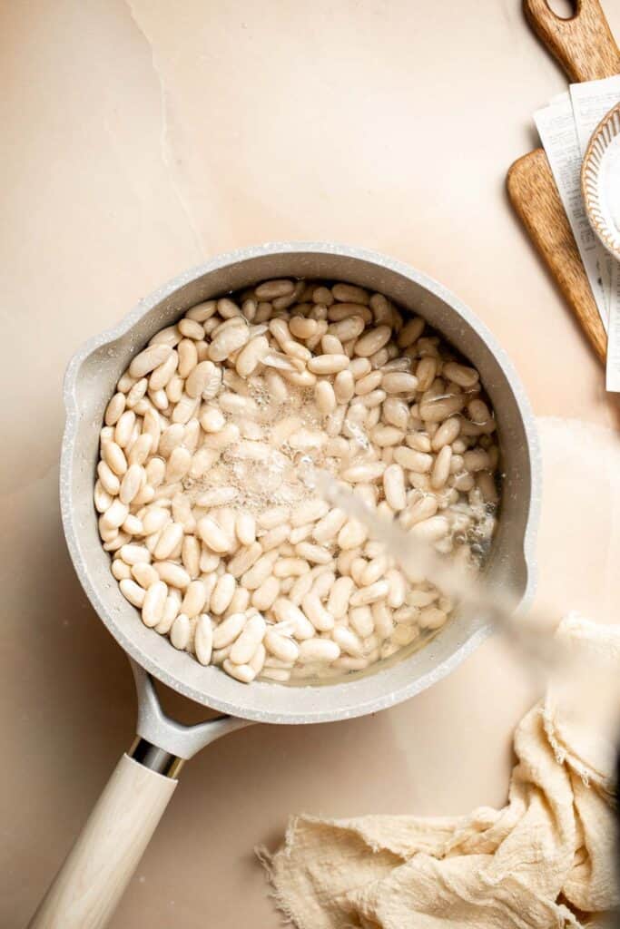 One pot Cannellini Beans are creamy, buttery, and nourishing. Serve them as a simple vegan side dish or as a delicious addition to soups, salads, and more. | aheadofthyme.com