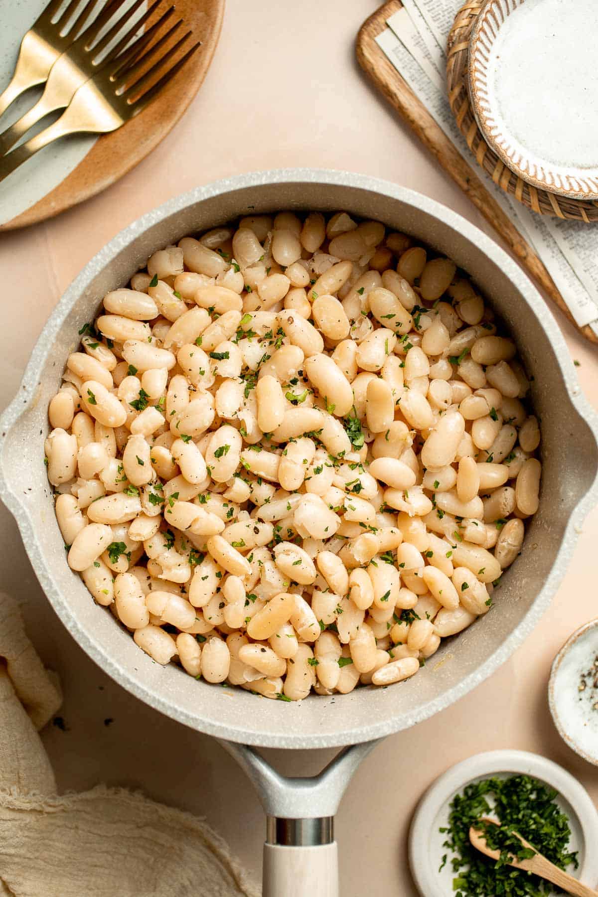 One pot Cannellini Beans are creamy, buttery, and nourishing. Serve them as a simple vegan side dish or as a delicious addition to soups, salads, and more. | aheadofthyme.com