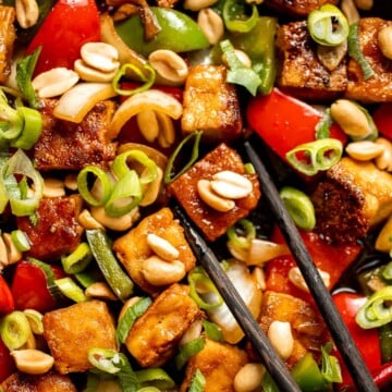 This homemade Kung Pao Tofu, made with perfectly crispy pan-fried tofu tossed in the most delicious sauce with peppers and onions is ready in 25 minutes. | aheadofthyme.com