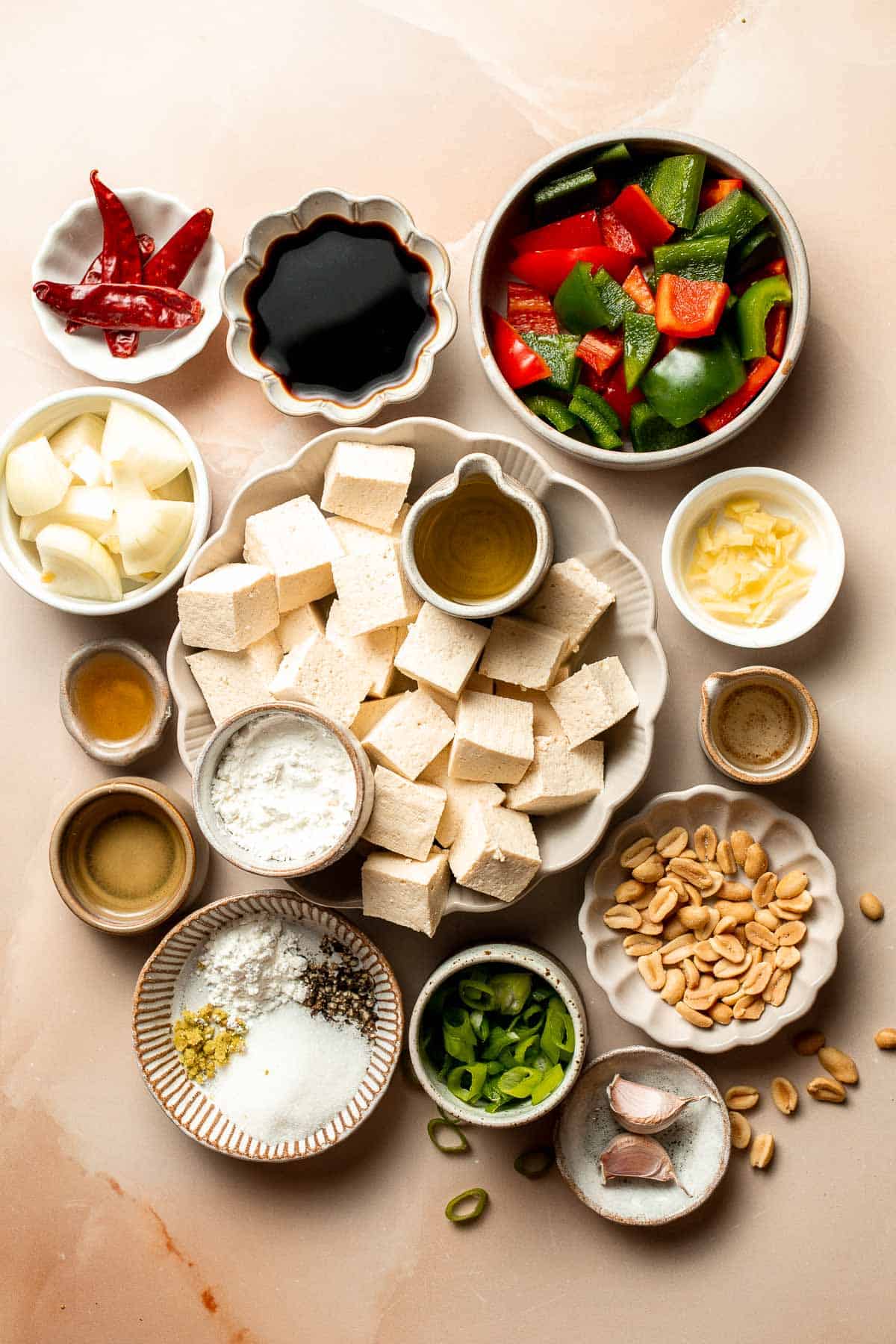 This homemade Kung Pao Tofu, made with perfectly crispy pan-fried tofu tossed in the most delicious sauce with peppers and onions is ready in 25 minutes. | aheadofthyme.com