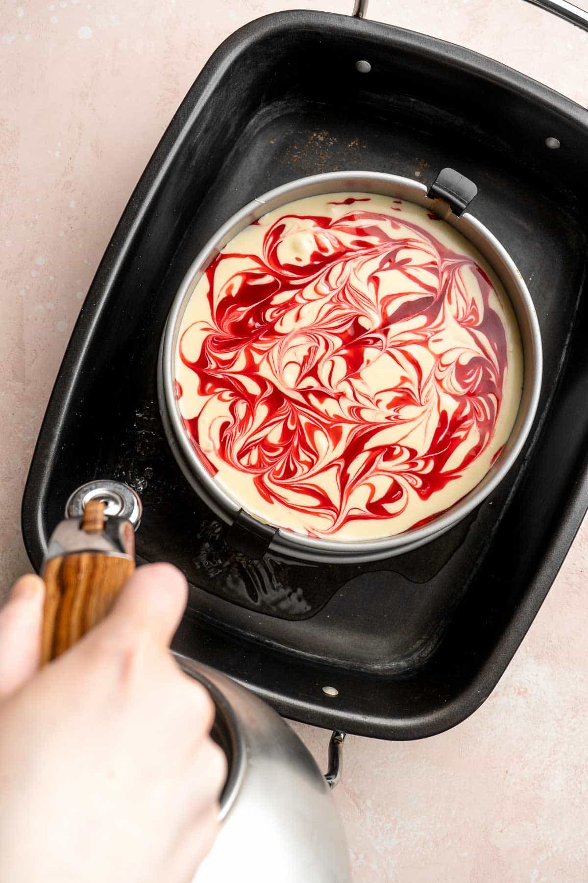 This White Chocolate Raspberry Cheesecake is so decadent, made with a creamy white chocolate cheesecake batter swirled with homemade raspberry sauce. | aheadofthyme.com