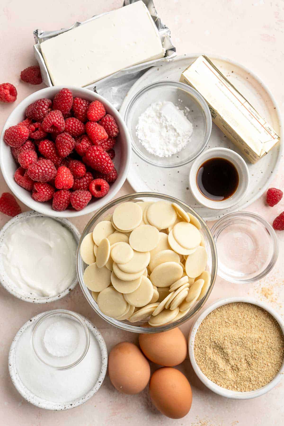 This White Chocolate Raspberry Cheesecake is so decadent, made with a creamy white chocolate cheesecake batter swirled with homemade raspberry sauce. | aheadofthyme.com