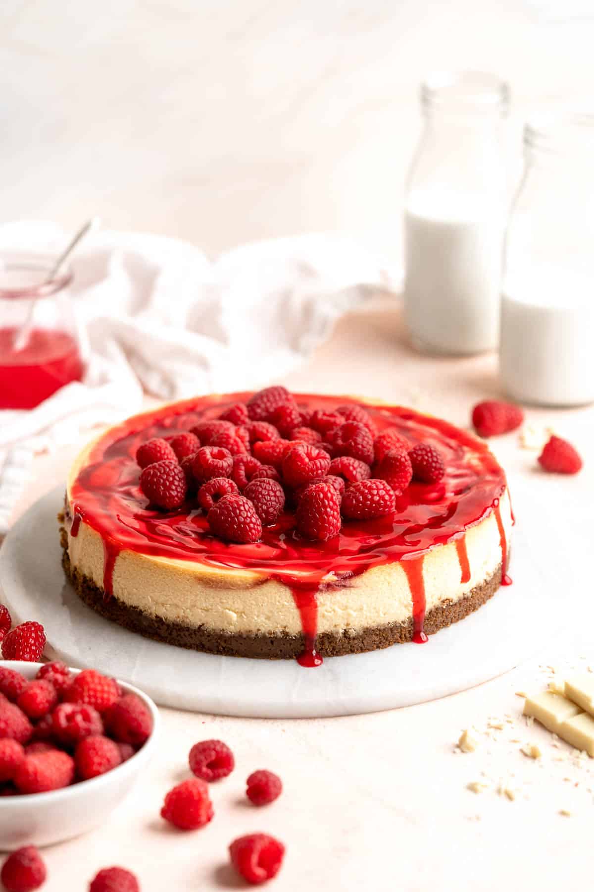 This White Chocolate Raspberry Cheesecake is so decadent, made with a creamy white chocolate cheesecake batter swirled with homemade raspberry sauce. | aheadofthyme.com