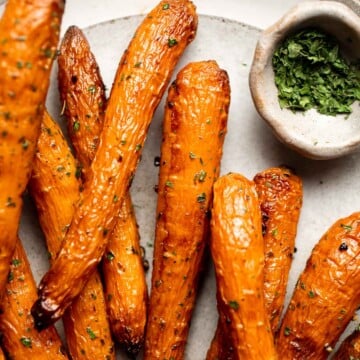 Balsamic Roasted Carrots are an easy side dish to make with a handful of simple ingredients that creates a complex blend of flavors in every bite. | aheadofthyme.com