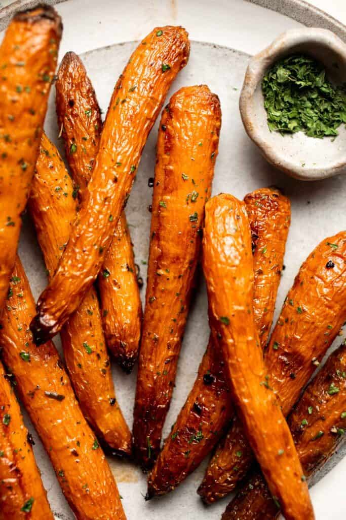 Balsamic Roasted Carrots are an easy side dish to make with a handful of simple ingredients that creates a complex blend of flavors in every bite. | aheadofthyme.com