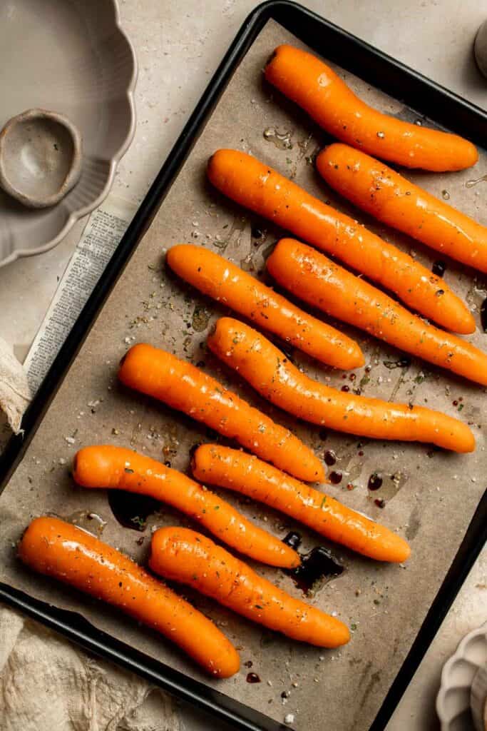 Balsamic Roasted Carrots are an easy side dish to make with a handful of simple ingredients that creates a complex blend of flavors in every bite. | aheadofthyme.com
