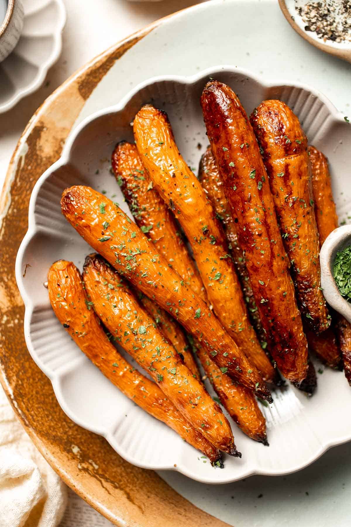 Balsamic Roasted Carrots are an easy side dish to make with a handful of simple ingredients that creates a complex blend of flavors in every bite. | aheadofthyme.com