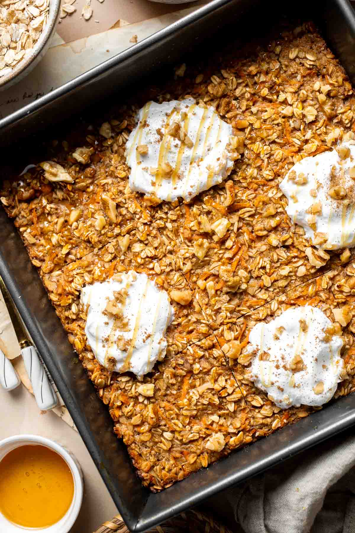 Start your day off right with the coziest Carrot Cake Baked Oatmeal, with all the flavors of the classic dessert — but for breakfast! | aheadofthyme.com