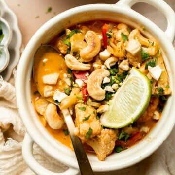 This creamy Cauliflower Curry is a quick and easy, one pot vegan meal that is ready in 25 minutes. Ditch the takeout and make this for weeknight dinner! | aheadofthyme.com