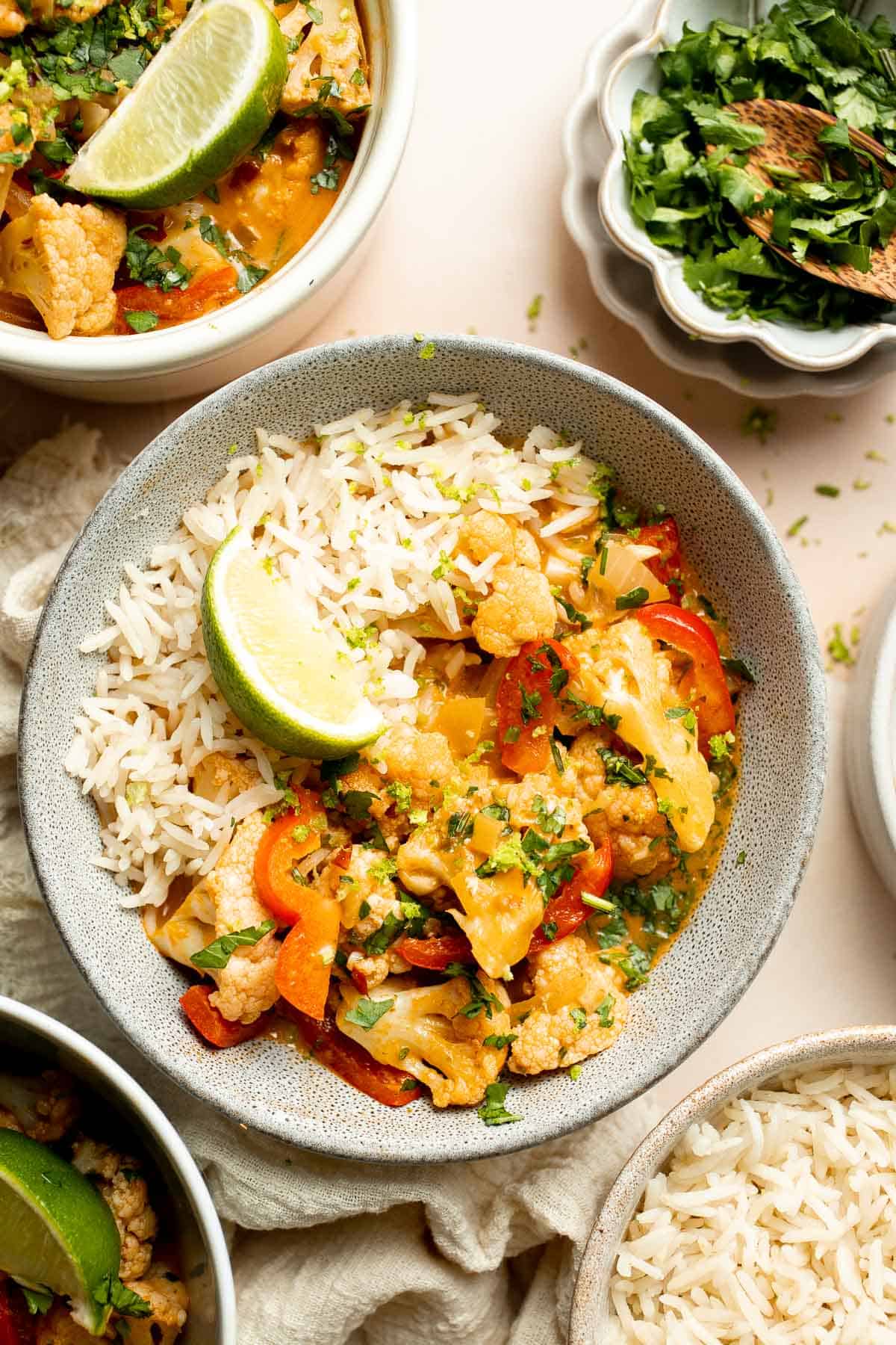 This creamy Cauliflower Curry is a quick and easy, one pot vegan meal that is ready in 25 minutes. Ditch the takeout and make this for weeknight dinner! | aheadofthyme.com