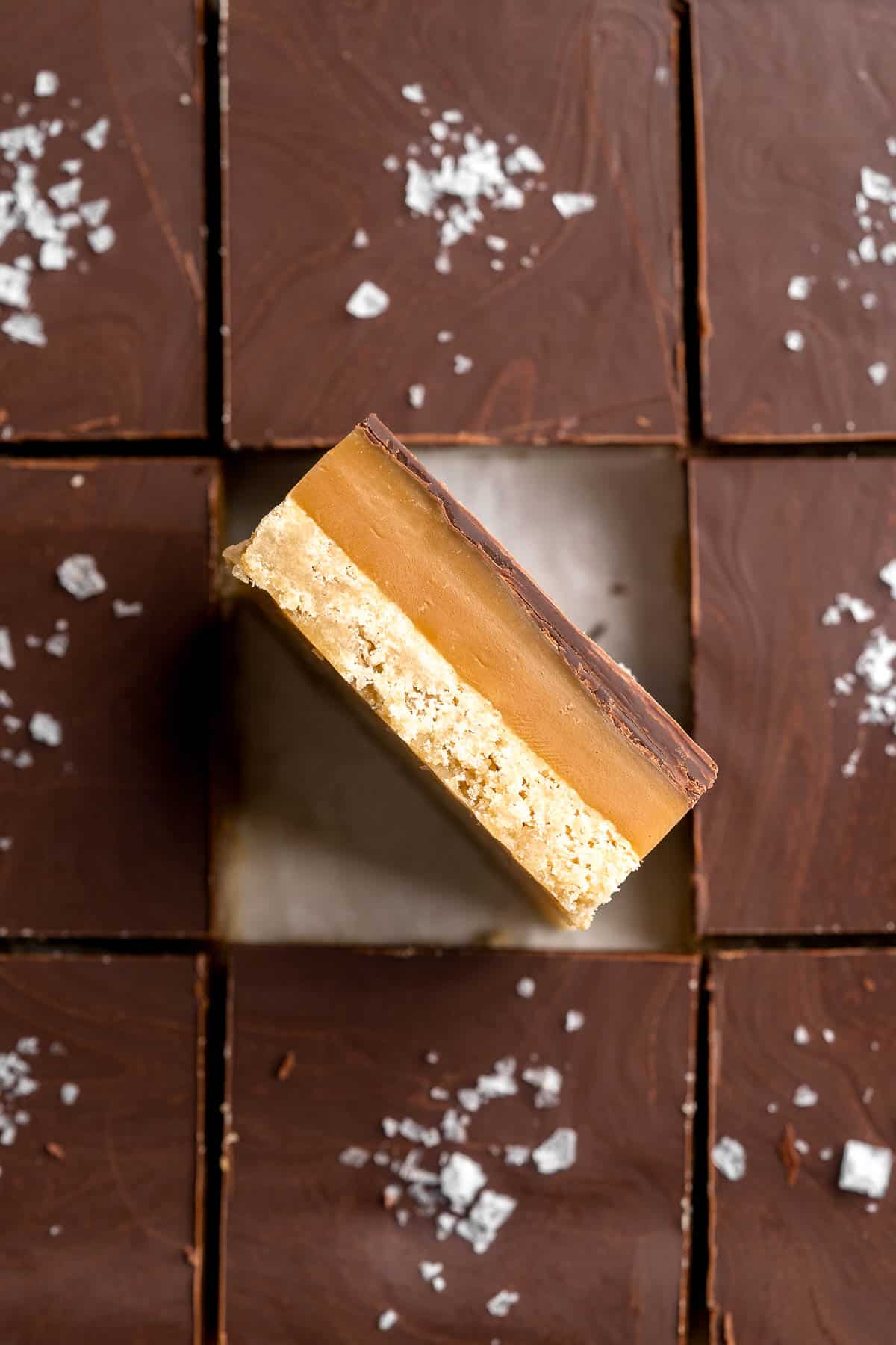 Millionaire's Shortbread are a triple-layered treat of buttery shortbread, homemade caramel, and chocolate for the perfect balance of textures and flavors. | aheadofthyme.com