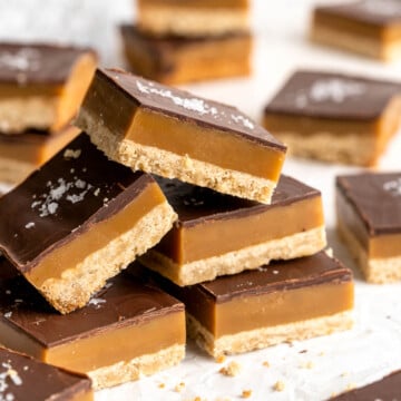 Millionaire's Shortbread are a triple-layered treat of buttery shortbread, homemade caramel, and chocolate for the perfect balance of textures and flavors. | aheadofthyme.com