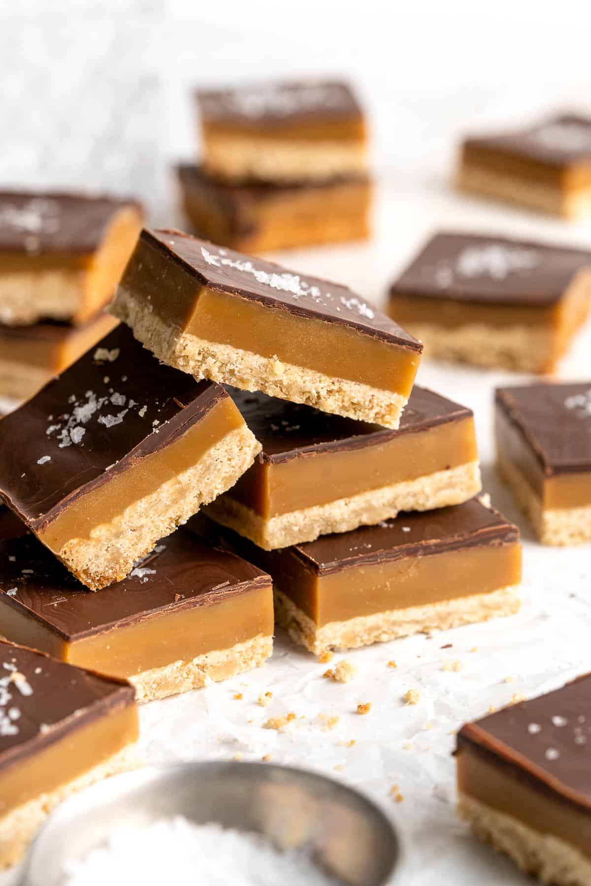 Millionaire's Shortbread are a triple-layered treat of buttery shortbread, homemade caramel, and chocolate for the perfect balance of textures and flavors. | aheadofthyme.com