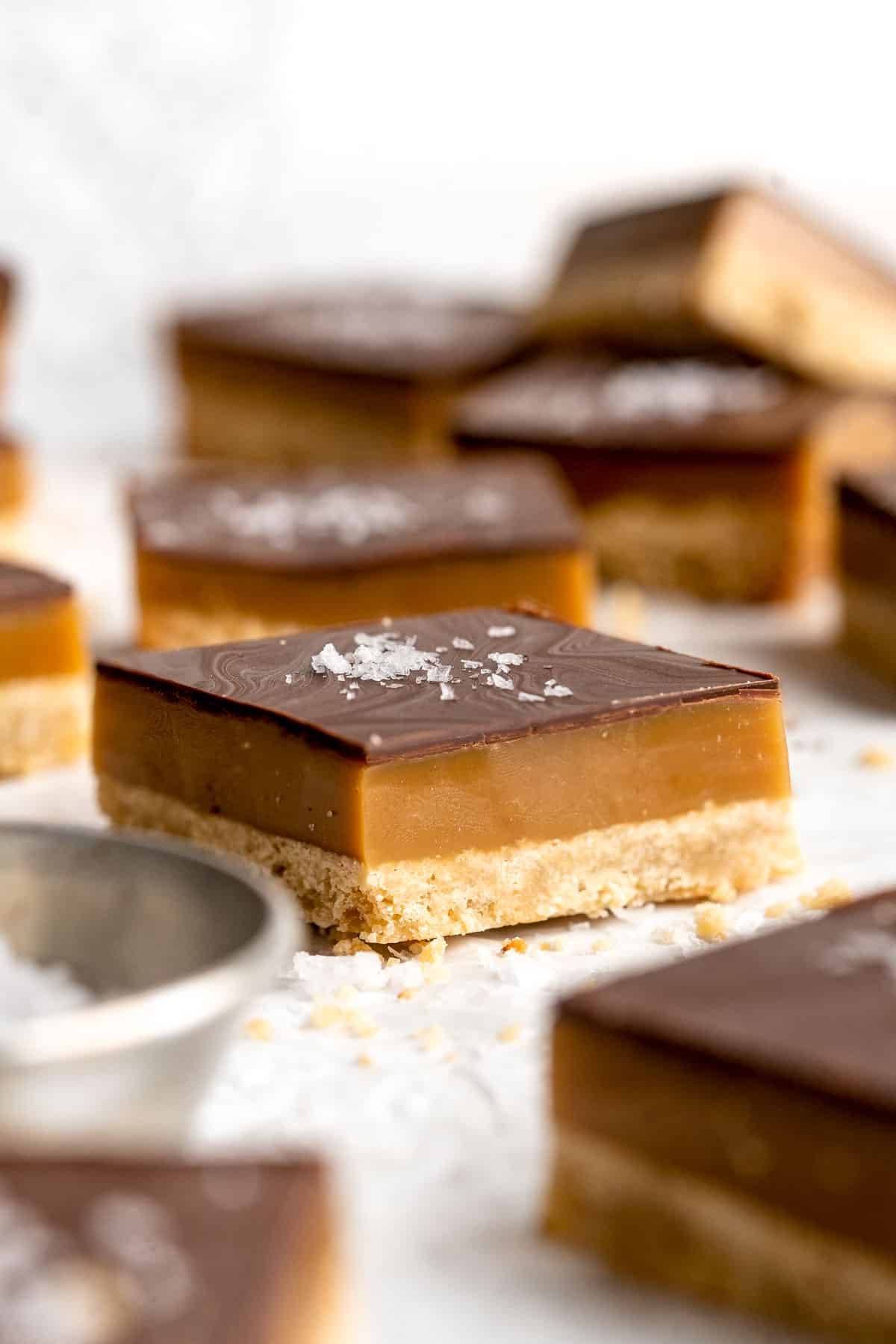 Millionaire's Shortbread are a triple-layered treat of buttery shortbread, homemade caramel, and chocolate for the perfect balance of textures and flavors. | aheadofthyme.com