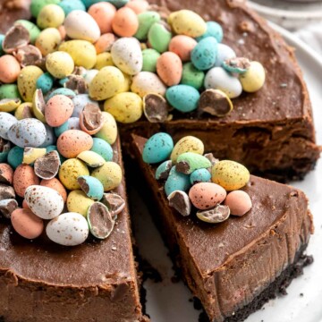 Mini Egg Easter Cheesecake is a rich and decadent triple chocolate cheesecake with an Oreo crust, chocolate cheesecake filling, and topped with mini eggs. | aheadofthyme.com