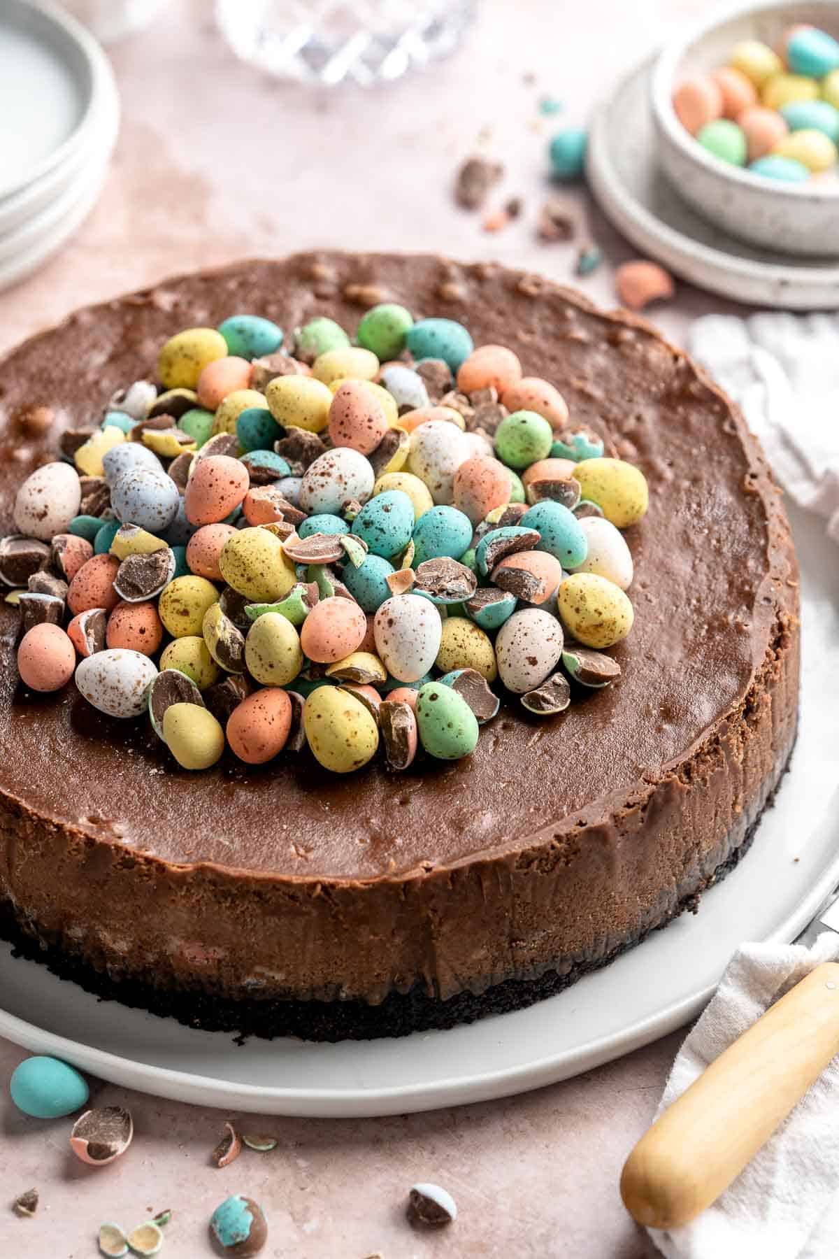 Mini Egg Easter Cheesecake is a rich and decadent triple chocolate cheesecake with an Oreo crust, chocolate cheesecake filling, and topped with mini eggs. | aheadofthyme.com