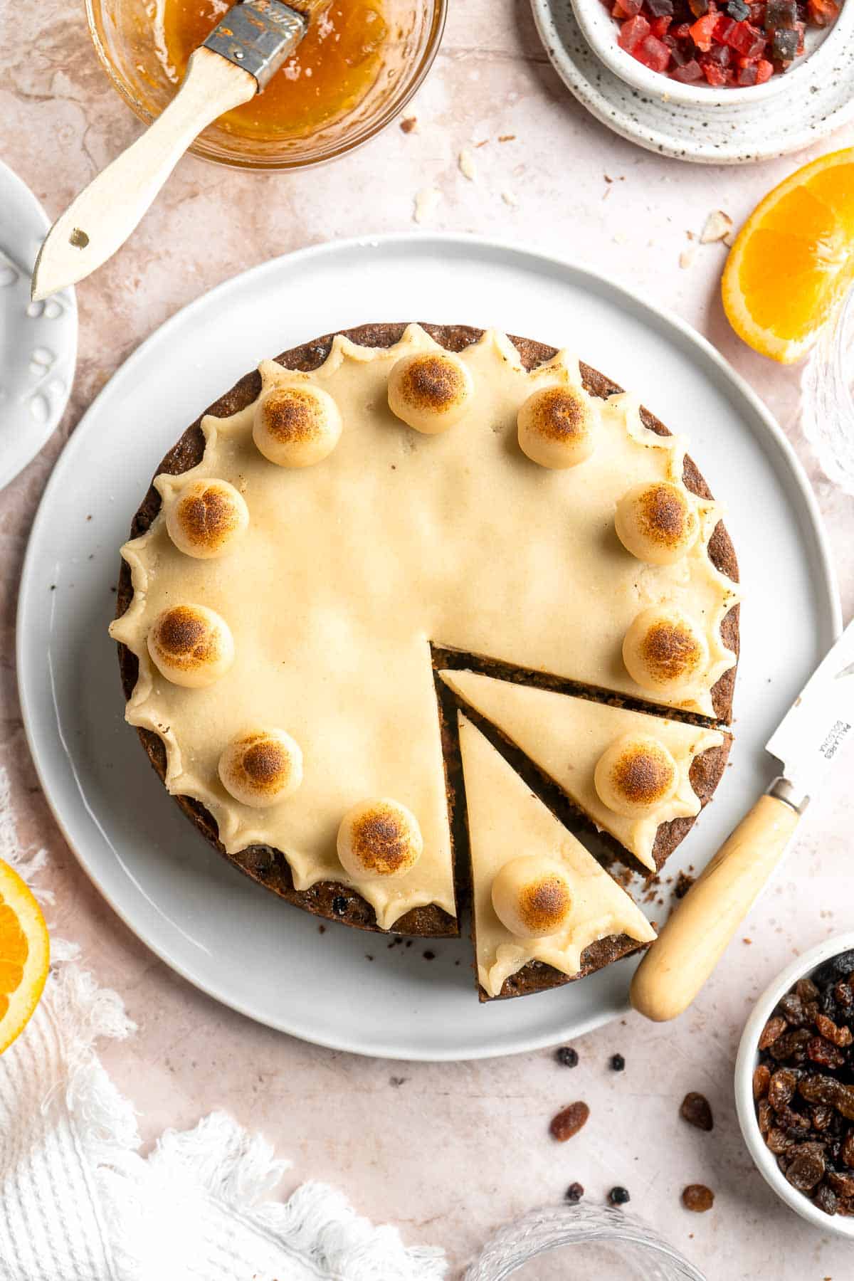 Simnel Cake is a traditional Easter fruitcake that is light and citrusy with two layers of marzipan which adds a delicious nutty flavor. | aheadofthyme.com