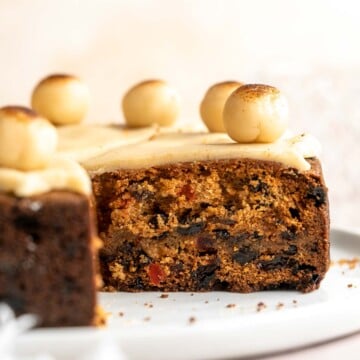 Simnel Cake is a traditional Easter fruitcake that is light and citrusy with two layers of marzipan which adds a delicious nutty flavor. | aheadofthyme.com