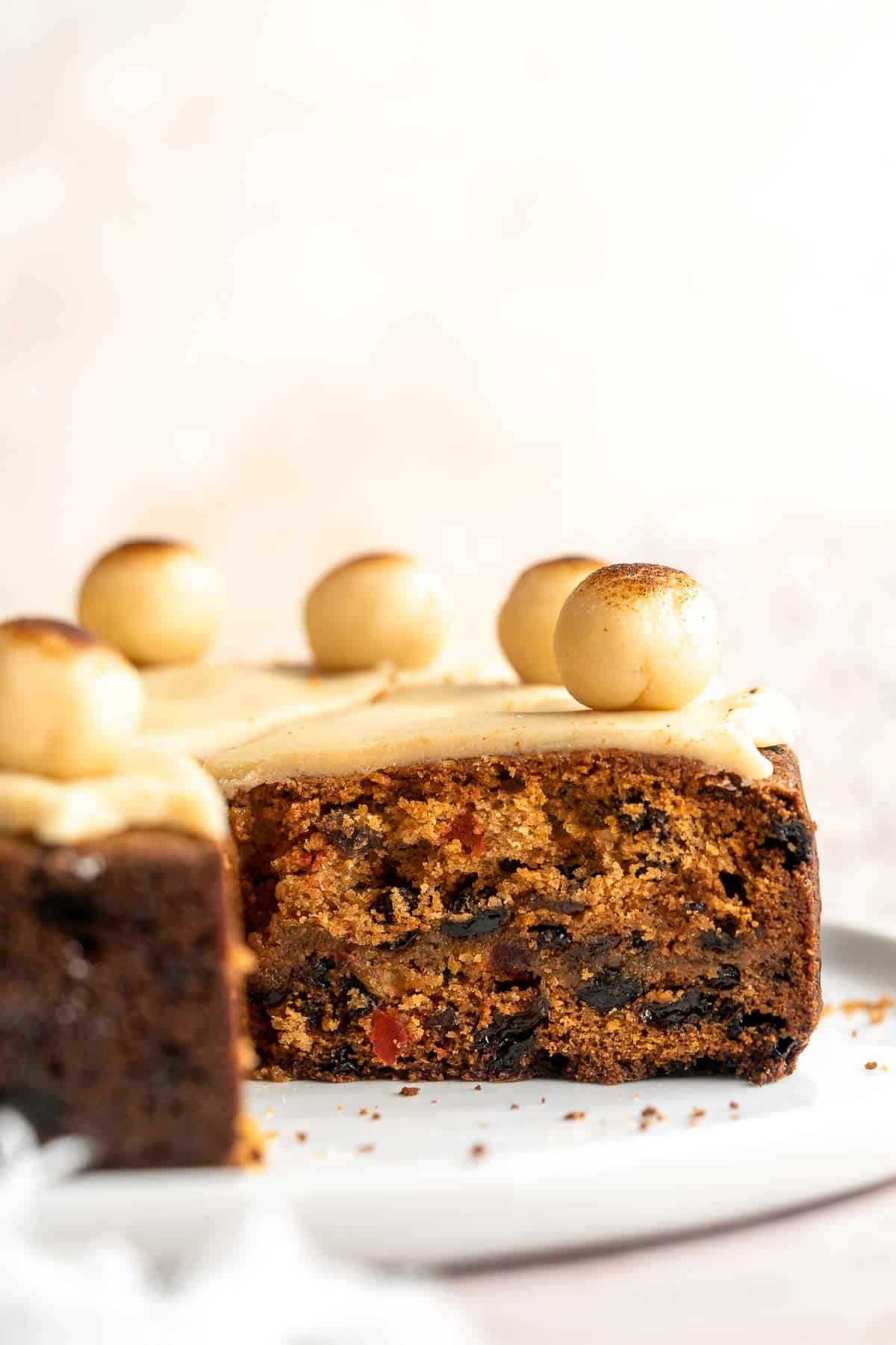 Simnel Cake is a traditional Easter fruitcake that is light and citrusy with two layers of marzipan which adds a delicious nutty flavor. | aheadofthyme.com