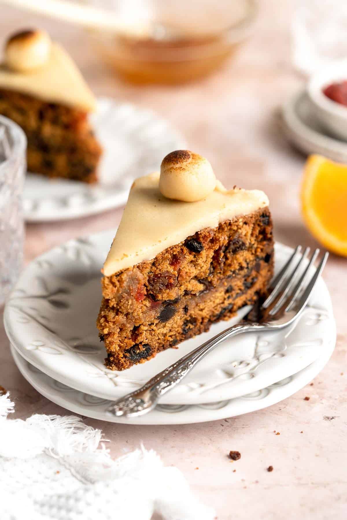 Simnel Cake is a traditional Easter fruitcake that is light and citrusy with two layers of marzipan which adds a delicious nutty flavor. | aheadofthyme.com