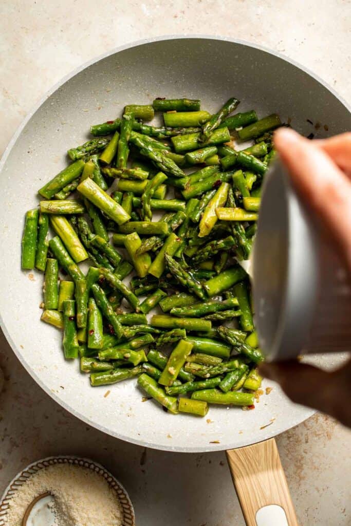 Make the most of the spring harvest with this delightfully simple lemony Asparagus Pasta recipe. Ready in under 20 minutes! | aheadofthyme.com