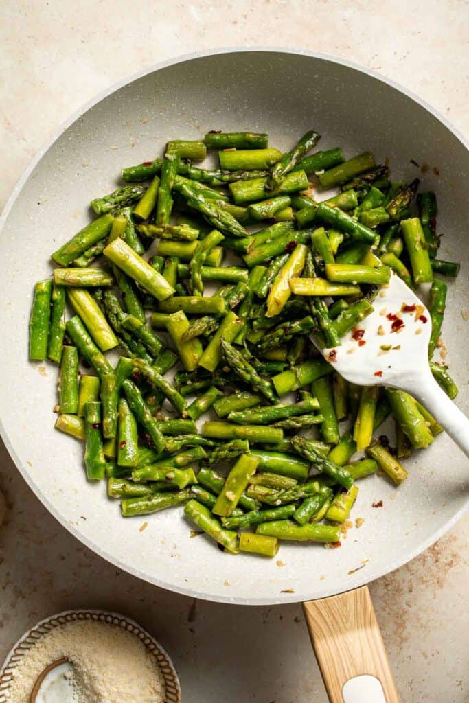 Make the most of the spring harvest with this delightfully simple lemony Asparagus Pasta recipe. Ready in under 20 minutes! | aheadofthyme.com