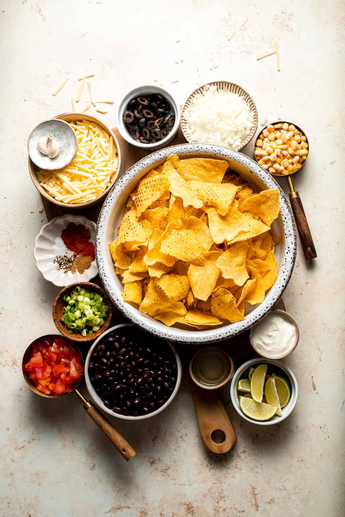 These loaded Black Bean Nachos are the ultimate vegetarian appetizer or snack — warm, crunchy, gooey, and so easy to make. | aheadofthyme.com