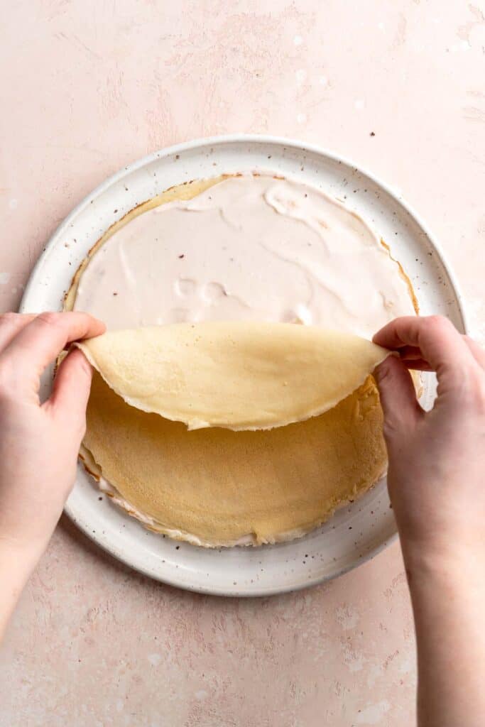 This no bake Crepe Cake is soft, decadent, and easy to make, with over 20 thin layers of crepes nestled between a berry mascarpone whipped cream filling. | aheadofthyme.com