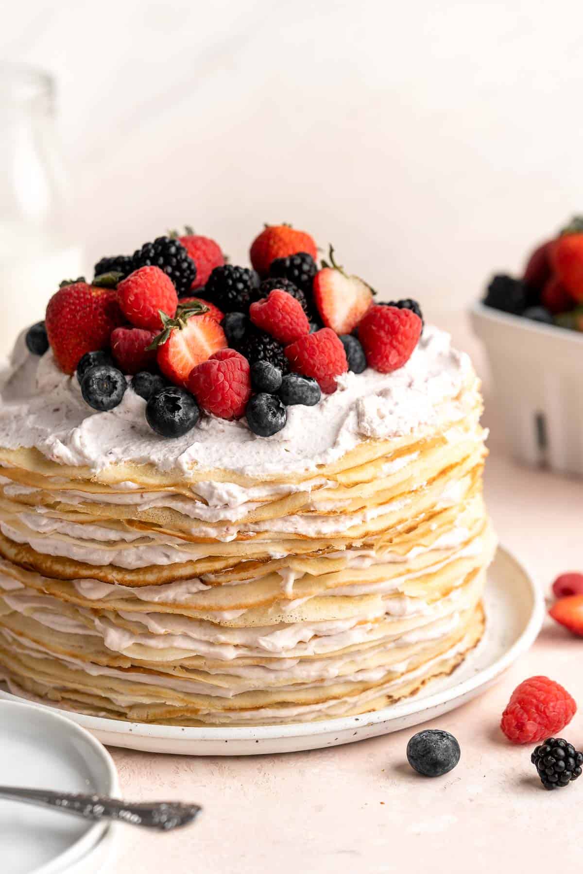 This no bake Crepe Cake is soft, decadent, and easy to make, with over 20 thin layers of crepes nestled between a berry mascarpone whipped cream filling. | aheadofthyme.com