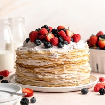 This no bake Crepe Cake is soft, decadent, and easy to make, with over 20 thin layers of crepes nestled between a berry mascarpone whipped cream filling. | aheadofthyme.com