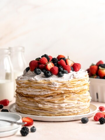 This no bake Crepe Cake is soft, decadent, and easy to make, with over 20 thin layers of crepes nestled between a berry mascarpone whipped cream filling. | aheadofthyme.com