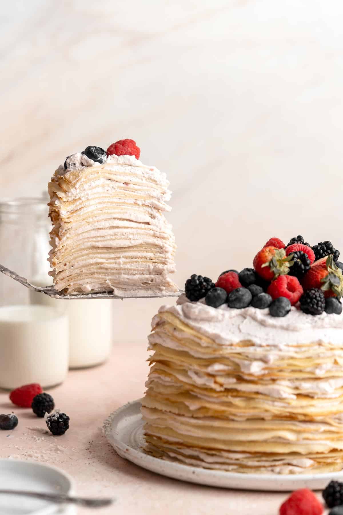 This no bake Crepe Cake is soft, decadent, and easy to make, with over 20 thin layers of crepes nestled between a berry mascarpone whipped cream filling. | aheadofthyme.com