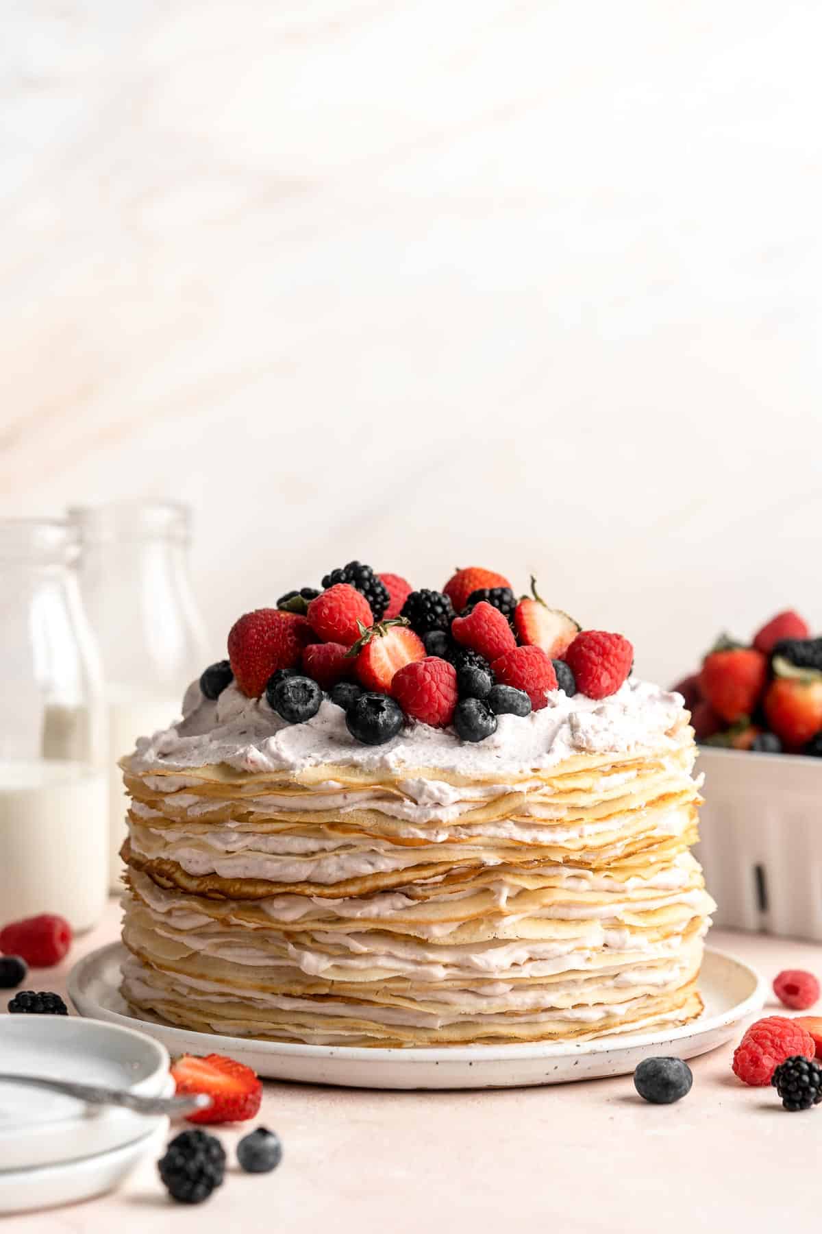 This no bake Crepe Cake is soft, decadent, and easy to make, with over 20 thin layers of crepes nestled between a berry mascarpone whipped cream filling. | aheadofthyme.com