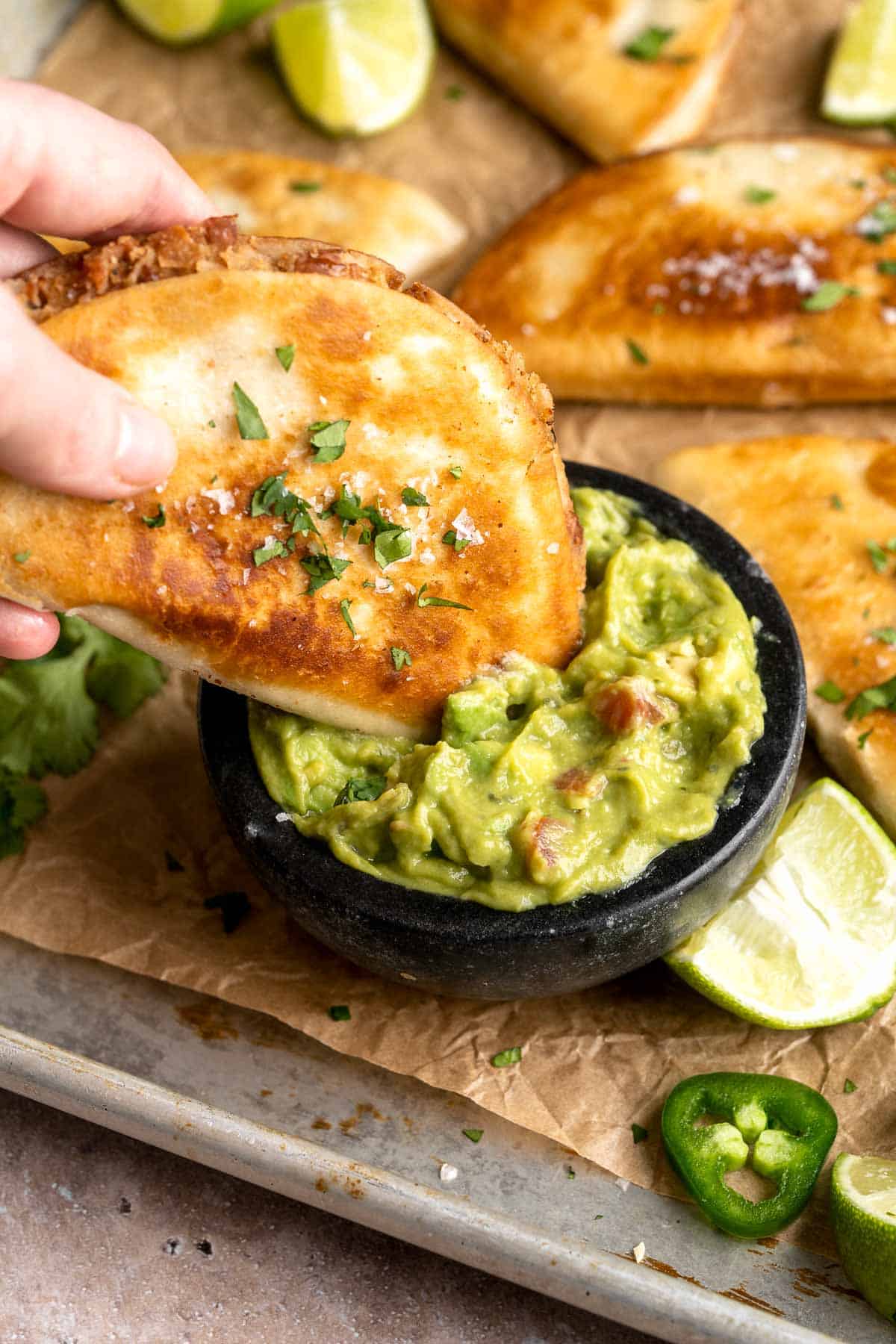 Crispy Refried Bean Tacos are made with crispy, golden-brown tortillas, perfectly seasoned refried beans, and a handful of your favorite taco garnishes. | aheadofthyme.com