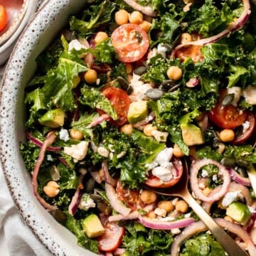 This Kale Chickpea Salad is light and refreshing, made with a mixture of fresh veggies, chickpeas, tangy feta, and a homemade lemon dijon vinaigrette. | aheadofthyme.com