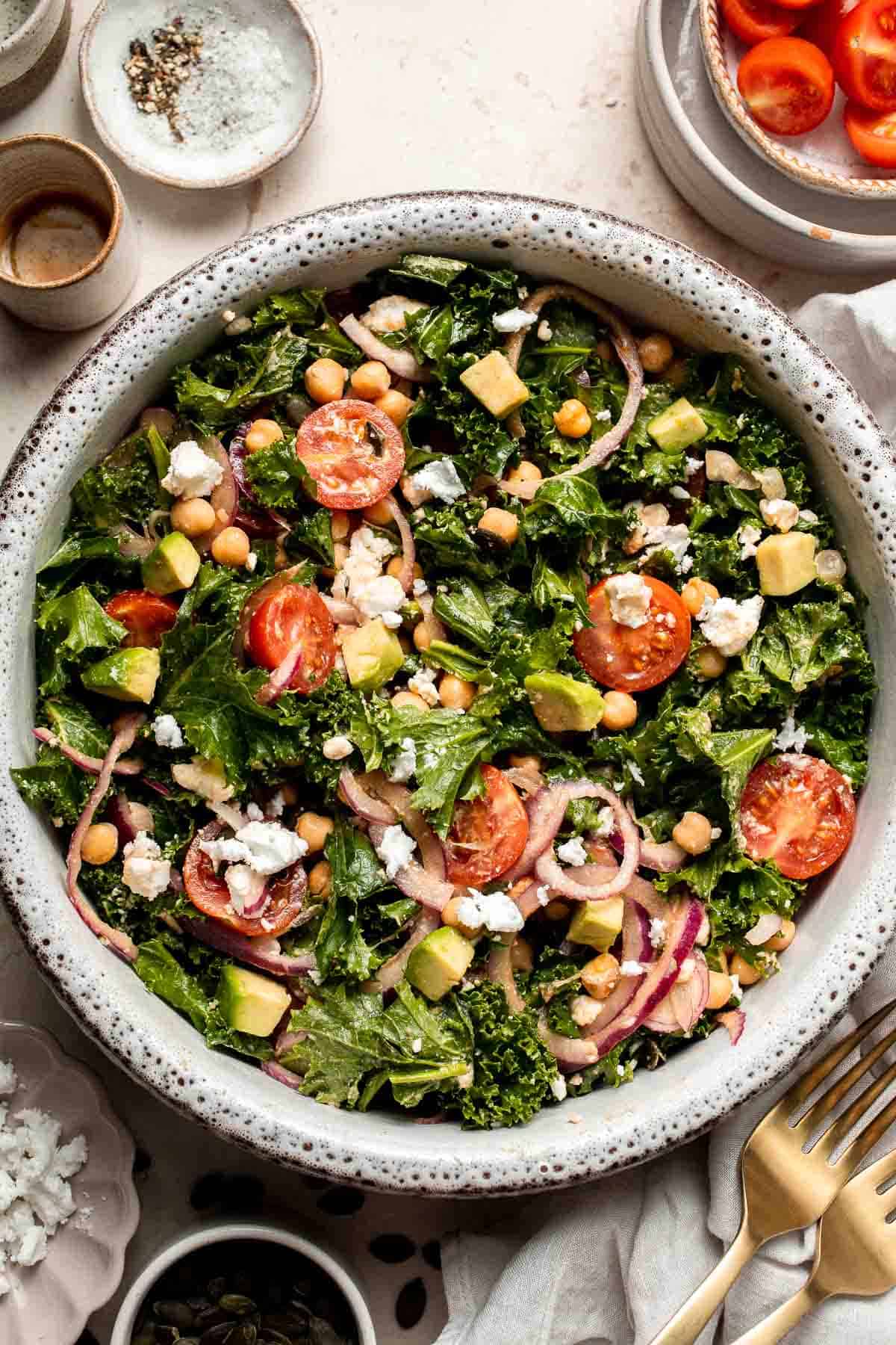 This Kale Chickpea Salad is light and refreshing, made with a mixture of fresh veggies, chickpeas, tangy feta, and a homemade lemon dijon vinaigrette. | aheadofthyme.com