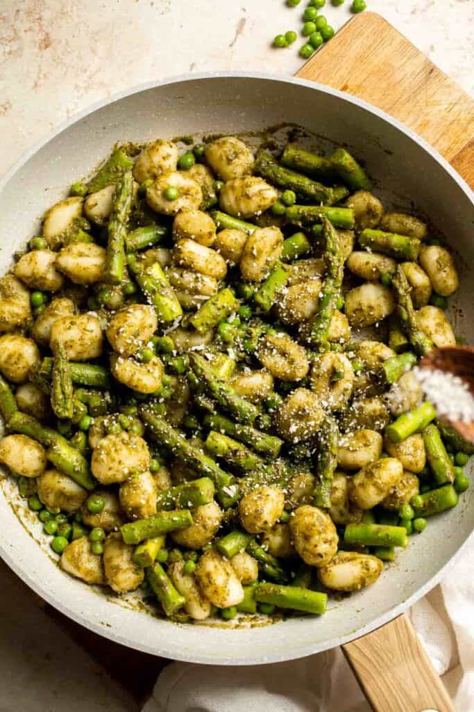Spring Vegetable Gnocchi with tender asparagus, peas, and pesto is the perfect way to enjoy the flavors of the season. Ready in 20 minutes! | aheadofthyme.com