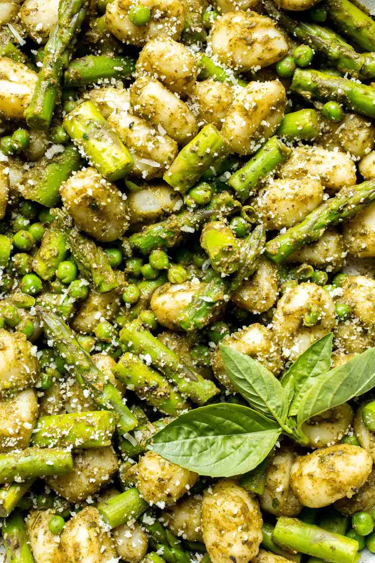 Spring Vegetable Gnocchi with tender asparagus, peas, and pesto is the perfect way to enjoy the flavors of the season. Ready in 20 minutes! | aheadofthyme.com